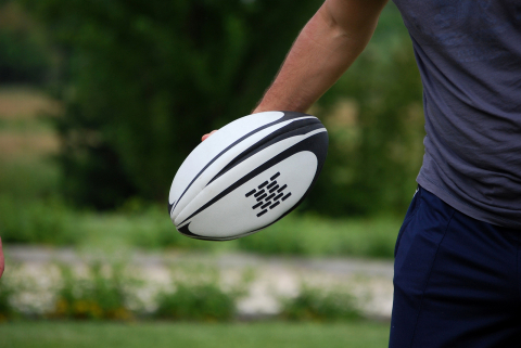 Man holding rugby ball