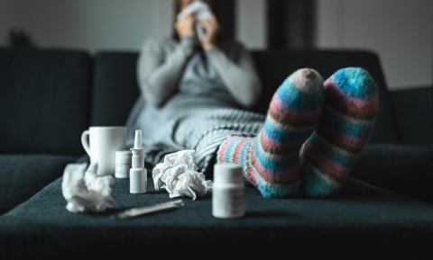 Woman with Covid-19 sitting on couch